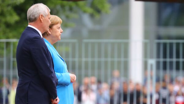 German Chancellor Angela Merkel receives Finland's new Social Democrat Prime Minister Antti Rinne with military honours at the Chancellery in Berlin, Germany, July 10, 2019 - Sputnik International