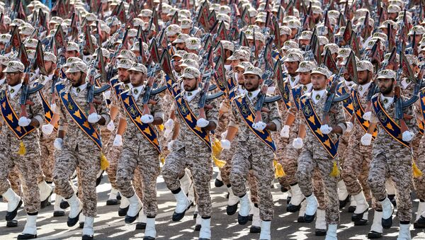 Members of Iran's Revolutionary Guards Corps (IRGC) march during the annual military parade marking the anniversary of the outbreak of the devastating 1980-1988 war with Saddam Hussein's Iraq, in the capital Tehran on September 22, 2018 - Sputnik International