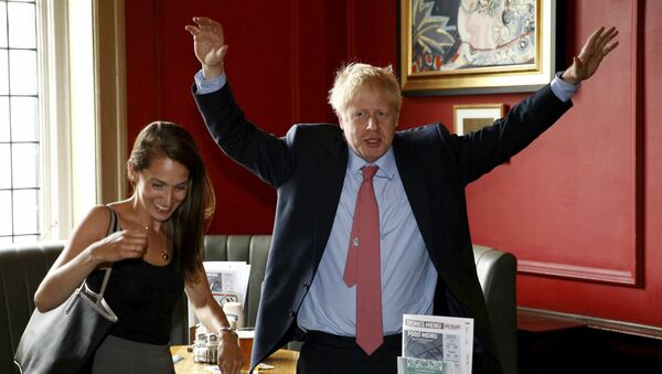 Conservative Party leadership candidate Boris Johnson gestures during a visit to Wetherspoons Metropolitan Bar in London, Wednesday July 10, 2019 - Sputnik International