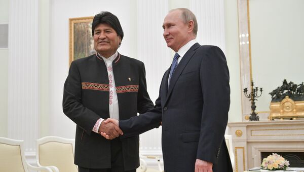 Bolivian President Evo Morales, left, and Russian President Vladimir Putin shake hands during their meeting at Moscow's Kremlin, Russia. Morales is on official visit to Russia - Sputnik International