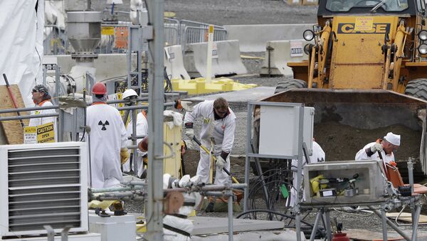 In this March 6, 2013 file photo, workers are shown at the 'C' Tank Farm at the Hanford Nuclear Reservation, near Richland, Wash. Conservation groups are alarmed by the Trump administration's proposal to rename some radioactive waste left from the production of nuclear weapons to make it cheaper and easier to achieve permanent disposal.  - Sputnik International