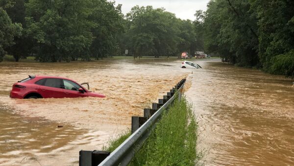 Cars are seen in flood waters on Clara Barton Parkway near Washington, U.S., July 8, 2019 in this picture obtained from social media - Sputnik International