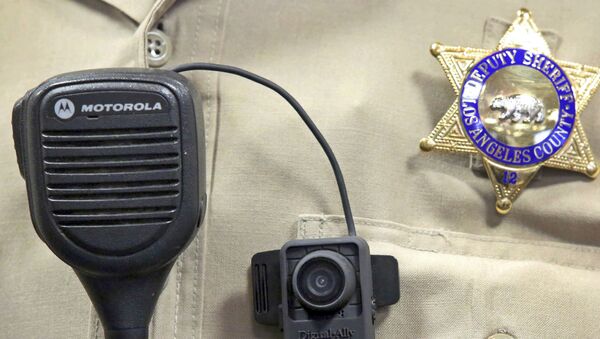 This Sept. 22, 2014 file photo shows a body camera on the uniform of a Los Angeles County Sheriff's deputy at department headquarters in Monterey Park, Calif. - Sputnik International