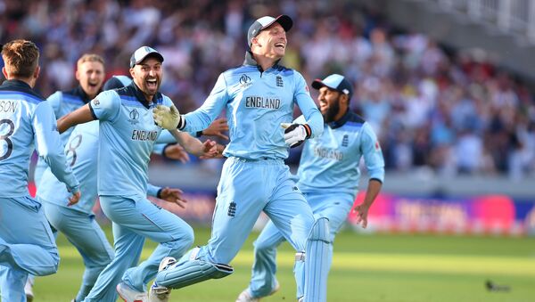 England's Jos Buttler (C) celebrates with teammates after they win the super over to win the 2019 Cricket World Cup final between England and New Zealand at Lord's Cricket Ground in London on July 14, 2019 - Sputnik International