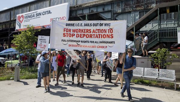 Hundreds of people arrive in Corona Plaza in the Queens borough of New York at the end of a march in opposition to the Trump administration's plans to continue with raids to catch immigrants in the country illegally, Sunday, July 14, 2019. - Sputnik International