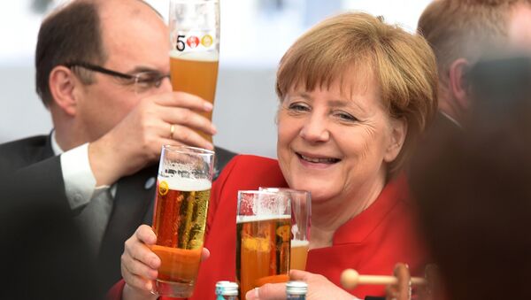 German Chancellor Angela Merkel toasts the 500th anniversary of the German beer purity requirements, in Ingolstadt, southern Germany, on April 22, 2016 - Sputnik International