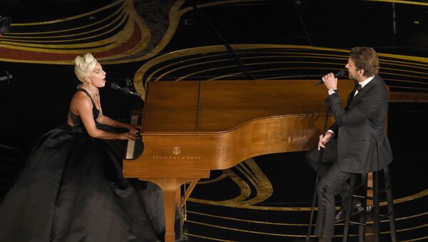 Lady Gaga, left, and Bradley Cooper perform Shallow from A Star is Born at the Oscars on Sunday, Feb. 24, 2019, at the Dolby Theatre in Los Angeles - Sputnik International