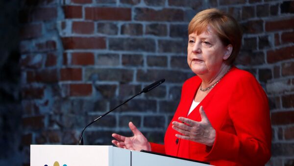 German Chancellor Angela Merkel speaks during a ceremony to mark 50 years of German development aid in Berlin, Germany, July 12, 2019 - Sputnik International