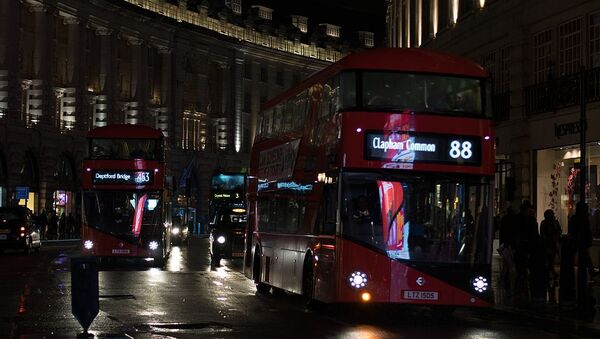 A red double-decker bus at night in Regent Street, London, United Kingdom - Sputnik International