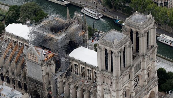 An aerial view shows the damaged roof of Notre-Dame de Paris during restoration work, three months after a fire that devastated the cathedral in Paris - Sputnik International