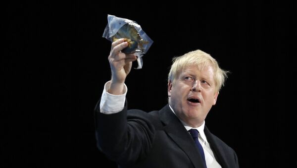   Conservative party leadership candidate Boris Johnson holds up a bagged smoked fish during his speech during a Conservative leadership hustings at ExCel Centre in London, Wednesday, July 17, 2019 - Sputnik International