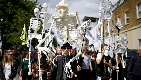 Extinction Rebellion activists march through East London, Britain July 13, 2019 - Sputnik International