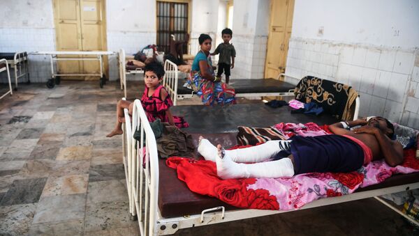 People injured when Cyclone Fani swept through India's eastern Odisha state rest at the district hospital in Puri on May 5, 2019 - Sputnik International