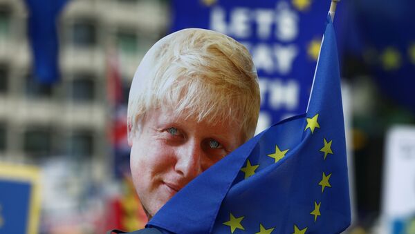 A protester wearing a mask depicting Boris Johnson attends an anti-Brexit 'No to Boris, Yes to Europe' march in London, Britain July 20, 2019. - Sputnik International