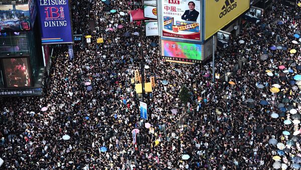 Protesters march against a controversial extradition bill in Hong Kong on July 21, 2019. - Sputnik International