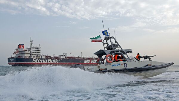 A picture taken on July 21, 2019, shows Iranian Revolutionary Guards patrolling around the British-flagged tanker Stena Impero as it's anchored off the Iranian port city of Bandar Abbas - Sputnik International