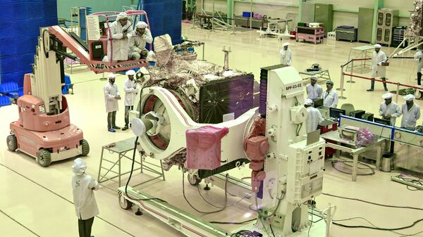 (FILES) In this file photo taken on June 12, 2019, Indian Space Research Organisation (ISRO) scientists work on the orbiter vehicle of 'Chandrayaan-2' - Sputnik International