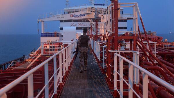  An Iranian Revolutionary Guard member walks onboard of Stena Impero, a British-flagged vessel owned by Stena Bulk, in Bandar Abbas port, Iran July 21, 2019. Picture taken July 21, 2019 - Sputnik International