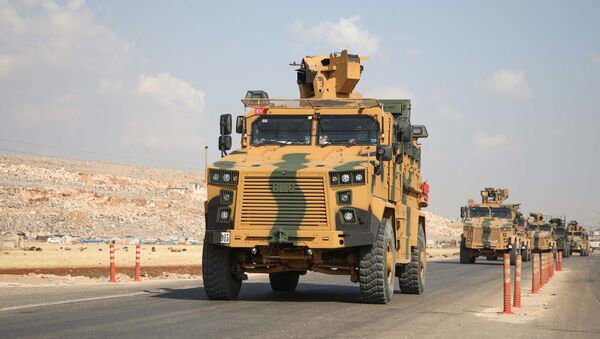 A convoy of Turkish armoured vehicles drive towards Bab al-Hawa crossing point between Syria and Turkey on a highway in the northern countryside of the Syrian province of Idlib on June 20, 2019. - Sputnik International