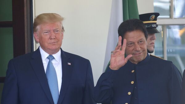 U.S. President Donald Trump stands with Pakistan’s Prime Minister Imran Khan at the White House in Washington, U.S., July 22, 2019 - Sputnik International
