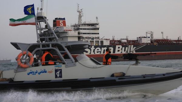 A boat of Iranian Revolutionary Guard sails next to Stena Impero, a British-flagged vessel owned by Stena Bulk, at Bandar Abbas port, in this undated handout photo - Sputnik International