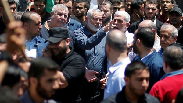 Hamas Chief Ismail Haniyeh, Gaza's Hamas Chief Yehya Al-Sinwar, and other Palestinian factions' leaders take part in a protest against Bahrain's workshop for U.S. Middle East peace plan, in Gaza City, June 26, 2019 - Sputnik International