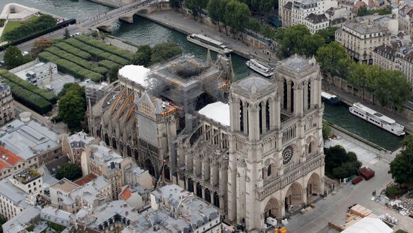 Parts of a destroyed ribbed vault and scaffolding are seen during preliminary work at Notre Dame Cathedral, three months after a major fire ravaged the centuries-old UNESCO World Heritage Site. - Sputnik International