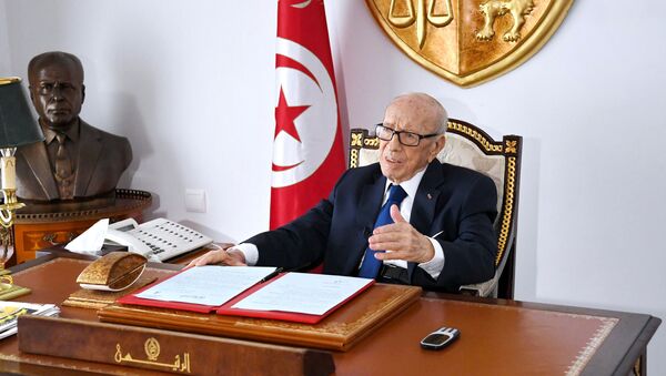 Tunisian President Beji Caid Essebsi sits at his desk at the Carthage Palace, in this handout picture obtained by Reuters on July 5, 2019, in Tunis, Tunisia - Sputnik International