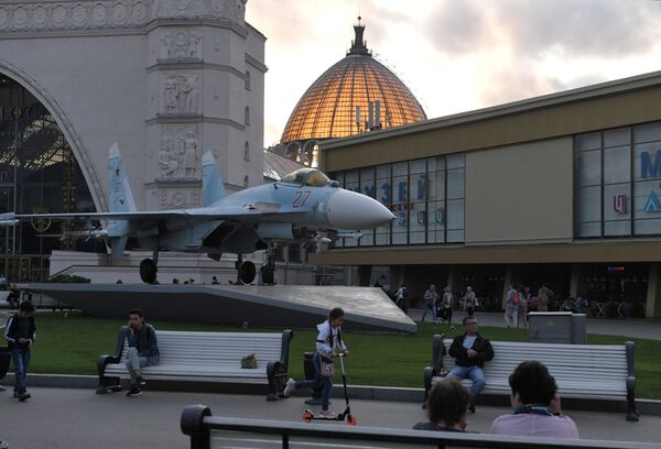 The Space pavilion (No 34) and a Su-27 multipurpose fighter jet at VDNKH park in Moscow.    - Sputnik International