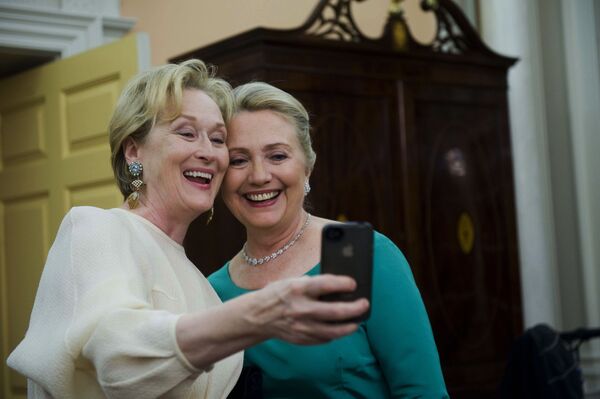 Actress Meryl Streep taking a selfie with Secretary of State Hillary Clinton during the Kennedy Centre Honours gala at the State Department in Washington on 1 December, 2012.  - Sputnik International
