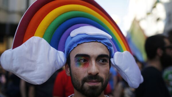 A man participates in the 'Trans Pride' parade in support of Lesbian, Gay, Bisexual and Transsexual LGBT rights, in Istanbul, Turkey, Sunday, June 21, 2015 - Sputnik International