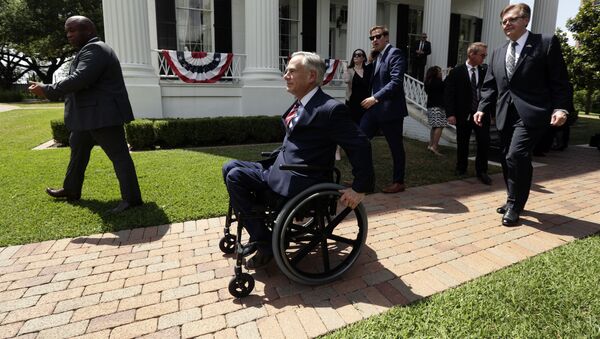 Governor Greg Abbott is followed by Lt. Governor Dan Patrick after a joint press conference to announce changes to teacher pay and school finance at the Texas Governor's Mansion in Austin, Texas, Thursday, May 23, 2019, in Austin. (AP Photo/Eric Gay) - Sputnik International