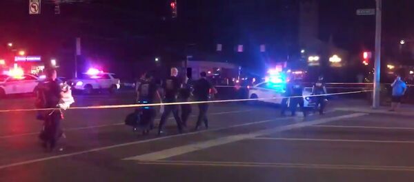 A screenshot taken from the Twitter account of Derek Myers on 4 August 2019, shows police officers following a mass shooting in Dayton, Ohio. - Sputnik International