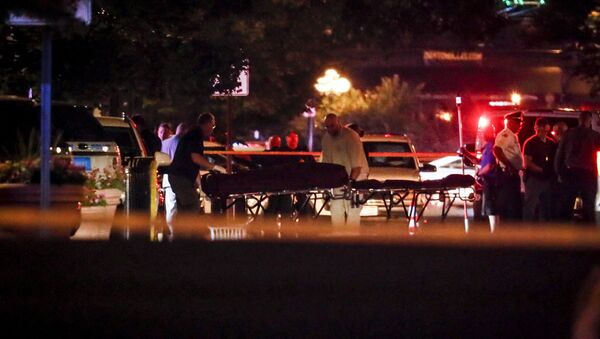 Bodies are removed from at the scene of a mass shooting, Sunday, Aug. 4, 2019, in Dayton, Ohio. Several people in Ohio have been killed in the second mass shooting in the U.S. in less than 24 hours, and the suspected shooter is also deceased, police said - Sputnik International