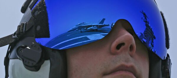 In this Thursday, May 30, 2019, photo released by the U.S. Navy, Lt. Rob Morris, from Annapolis, Md., observes an F/A-18F Super Hornet from the Jolly Rogers of Strike Fighter Squadron (VFA) 103 land on the flight deck of the Nimitz-class aircraft carrier USS Abraham Lincoln (CVN 72) in Arabian Sea In this Thursday, May 30, 2019, photo released by the U.S. Navy, Lt. Rob Morris, from Annapolis, Md., observes an F/A-18F Super Hornet from the Jolly Rogers of Strike Fighter Squadron (VFA) 103 land on the flight deck of the Nimitz-class aircraft carrier USS Abraham Lincoln (CVN 72) in Arabian Sea - Sputnik International