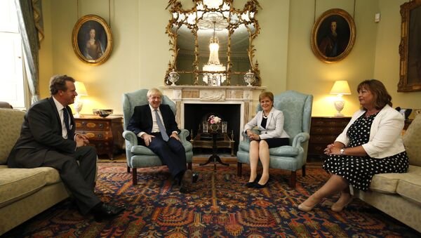 Britain's Scotland Secretary Alister Jack (L), Britain's Prime Minister Boris Johnson (2nd L), Scotland's First Minister Nicola Sturgeon (2nd R) and SNP (Scottish National Party) Cabinet Secretary for Culture, Tourism and External Affairs, Fiona Hyslop (R) pose for a photograph before talks at Bute House in Edinburgh during his visit to Scotland on July 29, 2019. - Sputnik International