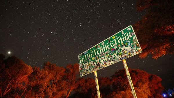 In this July 22, 2019 photo, a sign advertises state route 375 as the Extraterrestrial Highway, in Crystal Springs, Nev. The road boarders the Nevada Test and Training Range, the location of Area 51 - Sputnik International