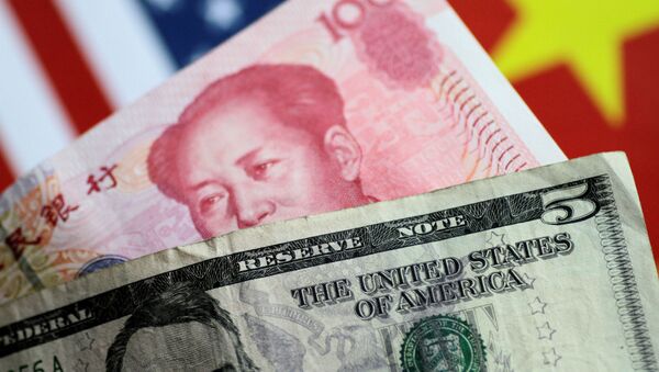 U.S. dollar and Chinese yuan notes are seen in this picture illustration June 2, 2017 - Sputnik International
