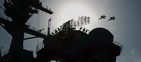 F/A-18 fighter jets fly over the deck of the USS Abraham Lincoln aircraft carrier in the Arabian Sea, Monday, June 3, 2019 - Sputnik International