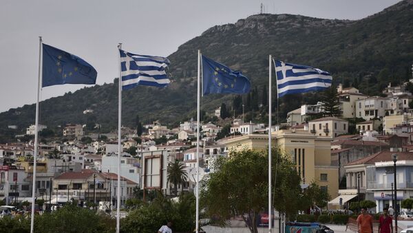 Greek and EU flags in the city of Vathy on the island of Samos, June 2019  - Sputnik International