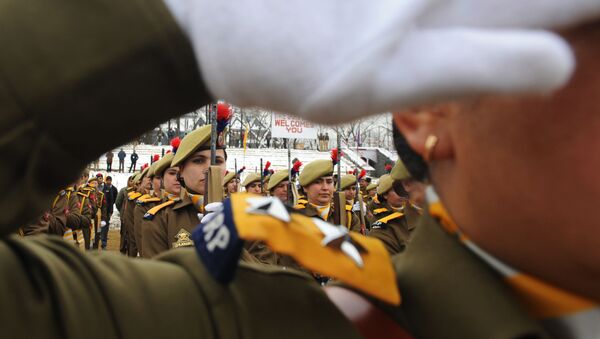 An Indian policewoman looks on while participating in a rehearsal for the upcoming 65th Republic Day in Srinagar on January 24, 2014 - Sputnik International