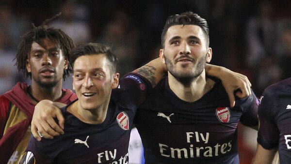 FILE - In this Thursday, May 9, 2019 file photo, Arsenal defender Sead Kolasinac, right celebrates with Arsenal midfielder Mesut Ozil, left, at the end of the Europa League semifinal soccer match, second leg, between Valencia and Arsenal at the Camp de Mestalla stadium in Valencia, Spain.  - Sputnik International