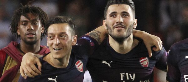 FILE - In this Thursday, May 9, 2019 file photo, Arsenal defender Sead Kolasinac, right celebrates with Arsenal midfielder Mesut Ozil, left, at the end of the Europa League semifinal soccer match, second leg, between Valencia and Arsenal at the Camp de Mestalla stadium in Valencia, Spain. FILE - In this Thursday, May 9, 2019 file photo, Arsenal defender Sead Kolasinac, right celebrates with Arsenal midfielder Mesut Ozil, left, at the end of the Europa League semifinal soccer match, second leg, between Valencia and Arsenal at the Camp de Mestalla stadium in Valencia, Spain. - Sputnik International
