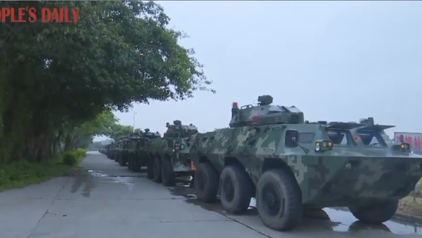 Convoy of armored personnel carriers belonging to the Chinese People's Armed Police Force seen traveling to Guangdong's Shenzhen region ahead of drills  - Sputnik International