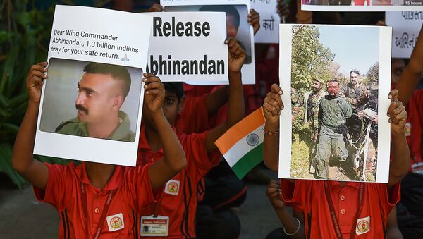 Indian students pray for a speedy release of Indian Air Force pilot Abhinandan Varthaman, in a school in Ahmedabad on February 28, 2019 - Sputnik International