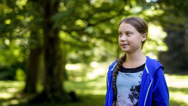 Swedish youth climate activist Greta Thunberg looks on during a meeting with Intergovernmental Panel on Climate Change (IPCC) representatives after the launch of a special IPCC report on climate change and land on 8 August 2019 in Geneva. - Sputnik International