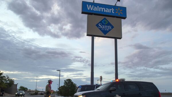 FILE - In this Aug. 4, 2019, file photo a Texas State Trooper walks back to his car while providing security outside the Walmart store in the aftermath of a mass shooting in El Paso, Texas.  Like most retailers, Walmart is accustomed to the everyday dealings of shoplifters. Now, it’s confronting a bigger threat: active shooters. Days after a man opened fire at one of its stores in El Paso and left several dead, the nation’s largest retailer is faced with how to make its workers and customers feel safe. - Sputnik International