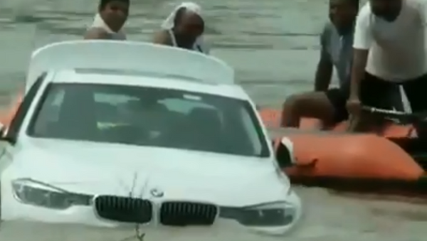 Indian man reportedly pushes BMW into river after not getting Jaguar he'd requested for his birthday - Sputnik International