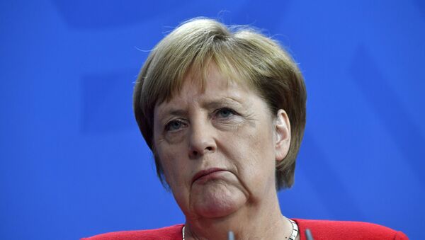 German Chancellor Angela Merkel reacts during a press conference with Moldova's Prime Minister at the Chancellery in Berlin on July 16, 2019. - Sputnik International