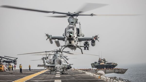 An AH-1Z Viper helicopter attached to Marine Medium Tiltrotor Squadron, 11th Marine Expeditionary Unit takes off during a strait transit aboard the amphibious assault ship USS Boxer. - Sputnik International